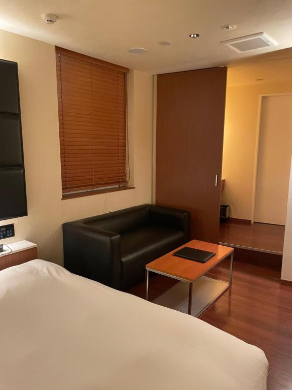 Postel nebo postele na pokoji v ubytování Hotel BIX チェックイン23時 変更不可