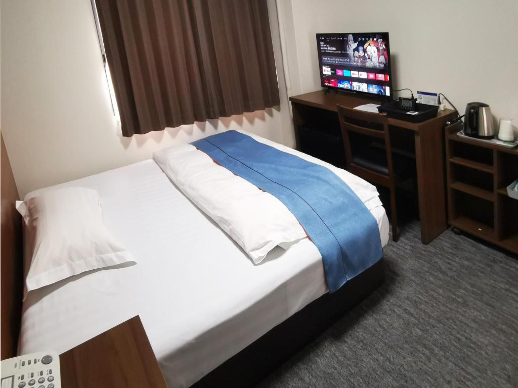 Postel nebo postele na pokoji v ubytování Business Hotel Azuma