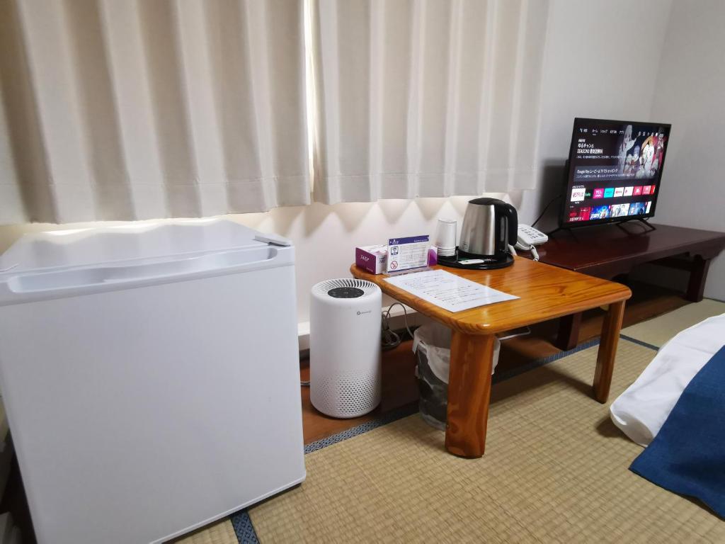 TV a/nebo společenská místnost v ubytování Business Hotel Azuma