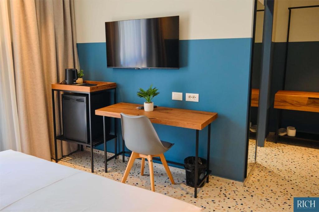 Postel nebo postele na pokoji v ubytování Rich Boutique Hotel
