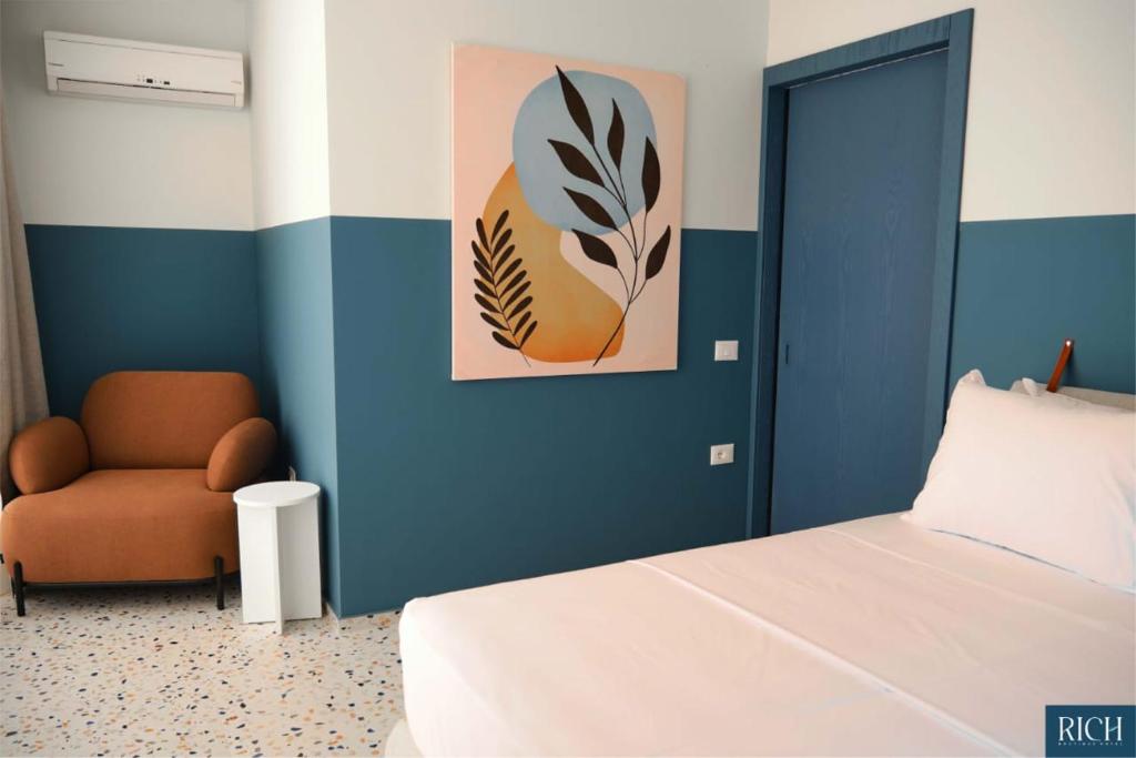 Postel nebo postele na pokoji v ubytování Rich Boutique Hotel