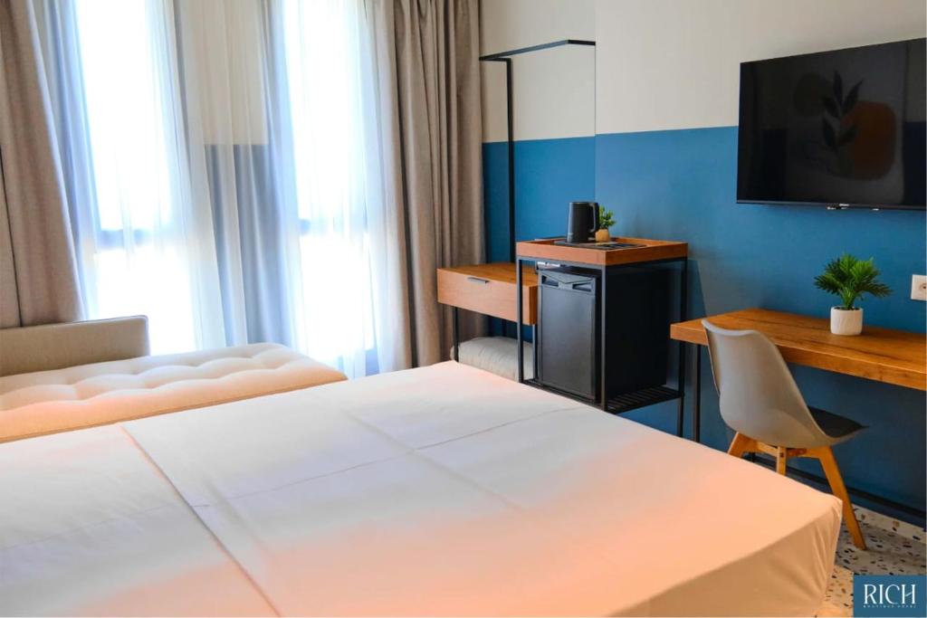 Postel nebo postele na pokoji v ubytování Rich Boutique Hotel