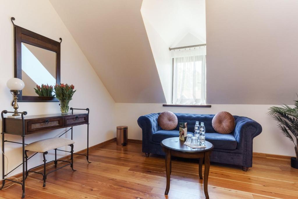 Posedenie v ubytovaní Apartamenty w Dworku Cheval