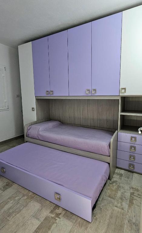 Postel nebo postele na pokoji v ubytování Serendipity, La Caletta