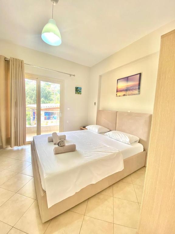 Postel nebo postele na pokoji v ubytování Foti Rooms