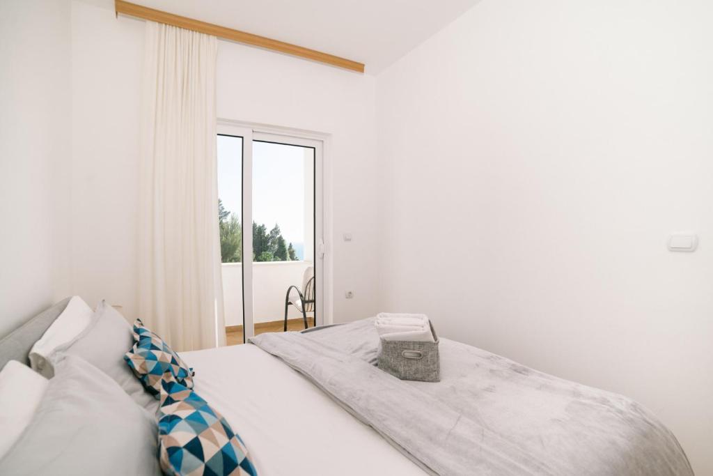 Postel nebo postele na pokoji v ubytování Apartments Lungo Mare Ulcinj