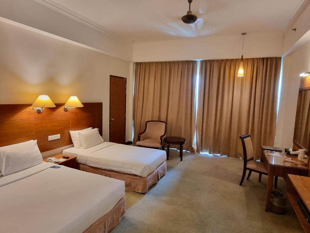 Postel nebo postele na pokoji v ubytování Heritage Hotel Cameron Highlands