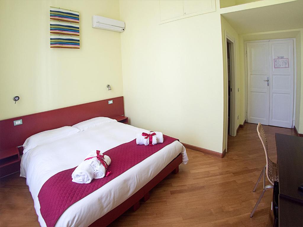 Postel nebo postele na pokoji v ubytování Residenza Viani Guest House