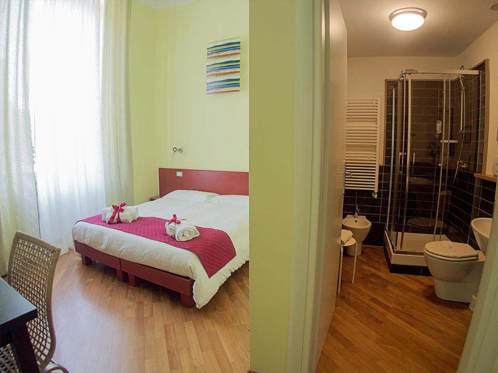 Postel nebo postele na pokoji v ubytování Residenza Viani Guest House