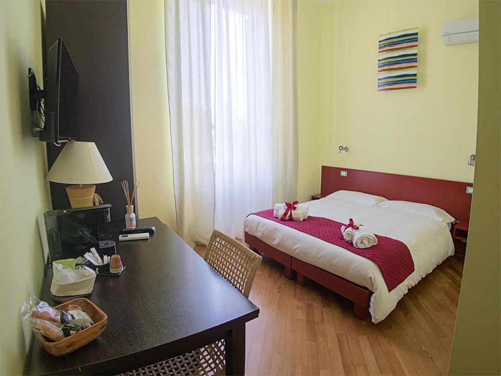 Postel nebo postele na pokoji v ubytování Residenza Viani Guest House