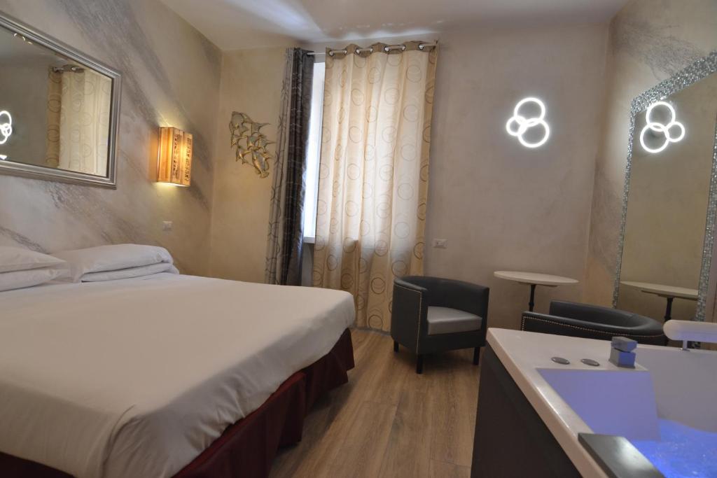 Postel nebo postele na pokoji v ubytování Hotel Santa Prassede