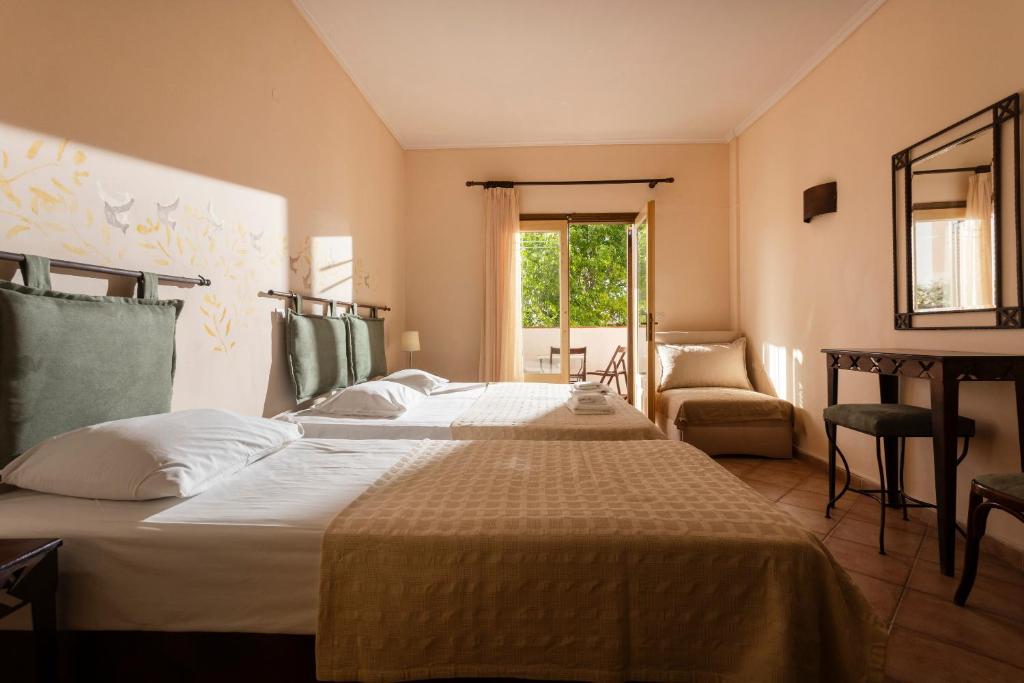 Posteľ alebo postele v izbe v ubytovaní Ammon Garden Hotel