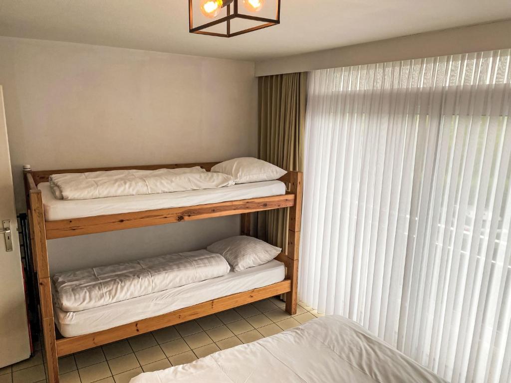 Postel nebo postele na pokoji v ubytování Apartment 103 by Interhome