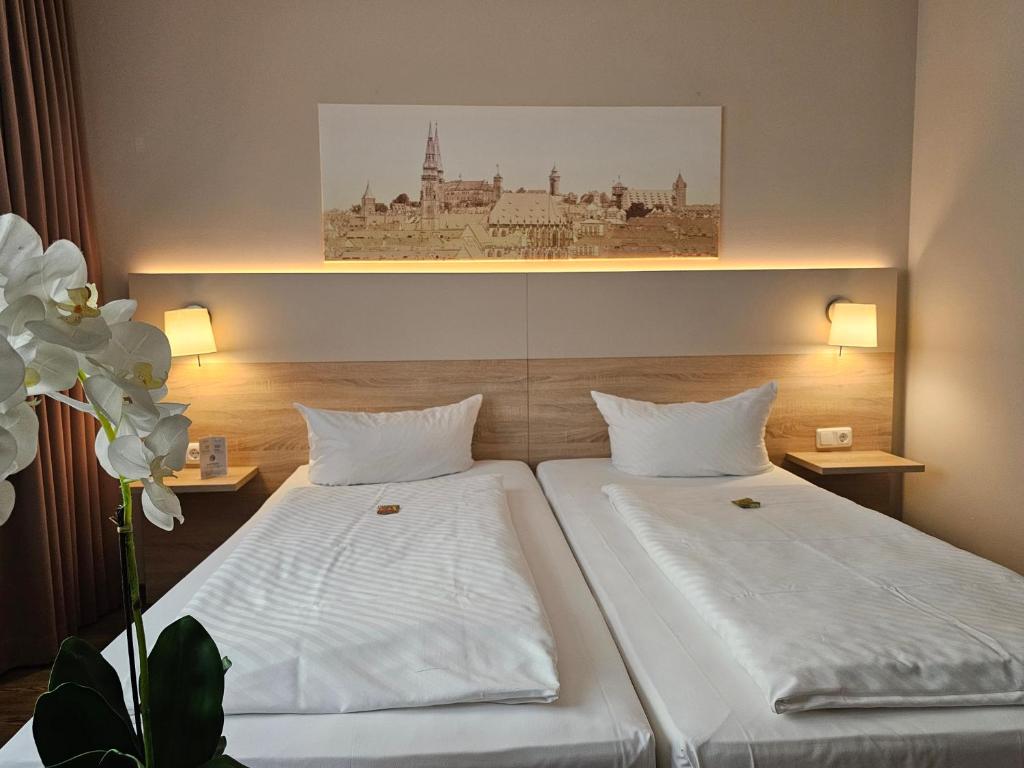 Postel nebo postele na pokoji v ubytování Hotel Alpha