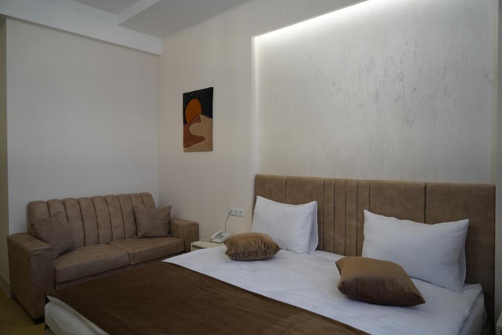 Postel nebo postele na pokoji v ubytování Igit Plaza Hotel