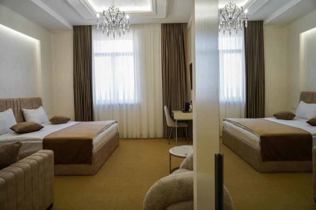 Postel nebo postele na pokoji v ubytování Igit Plaza Hotel
