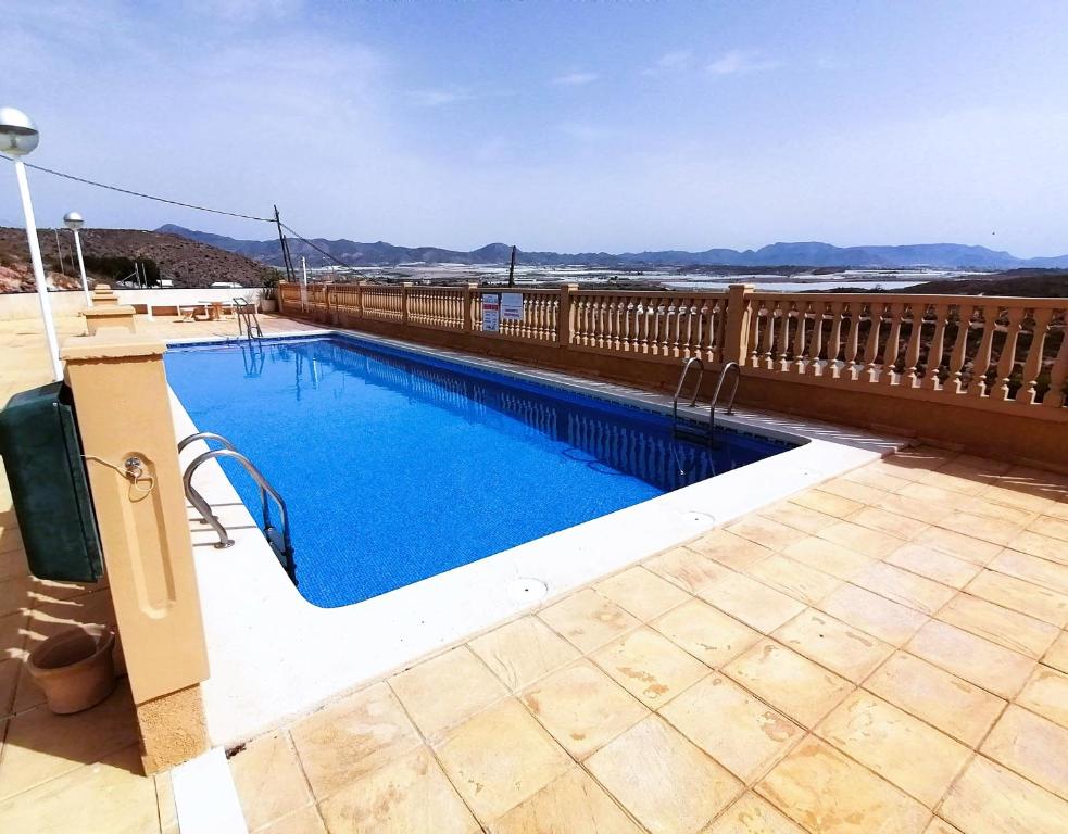 a swimming pool on the roof of a house at Bol01 - Modern 2 bedroom apartment in Bolnuevo in Bolnuevo