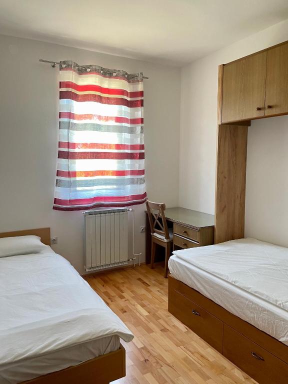 Postel nebo postele na pokoji v ubytování APARTMA BRIN Podgorje