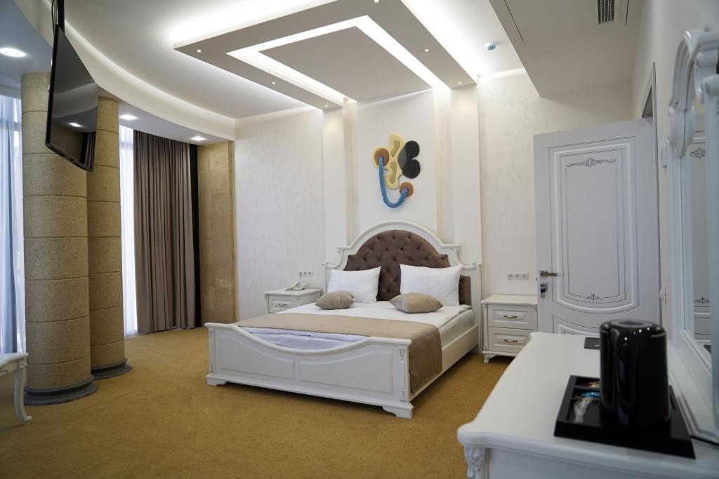 Postel nebo postele na pokoji v ubytování Igit Plaza Hotel