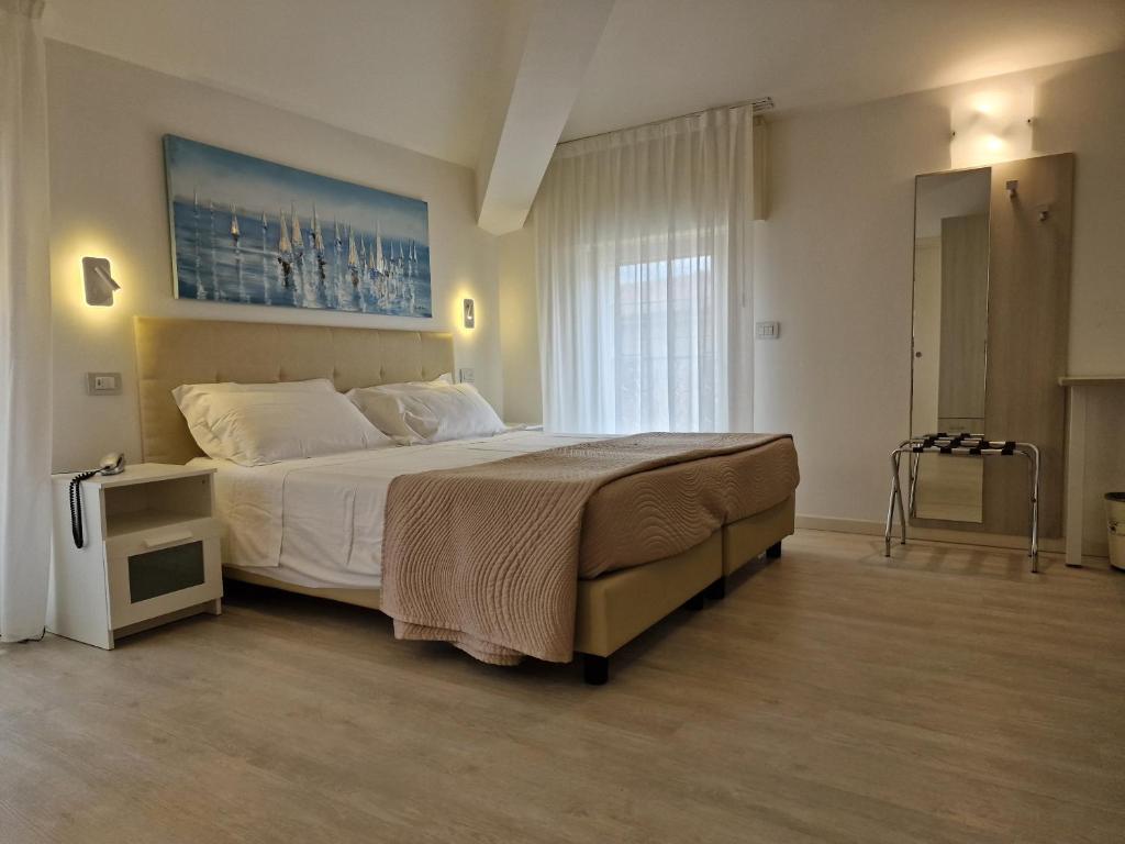 Postel nebo postele na pokoji v ubytování Hotel Villa Anthea