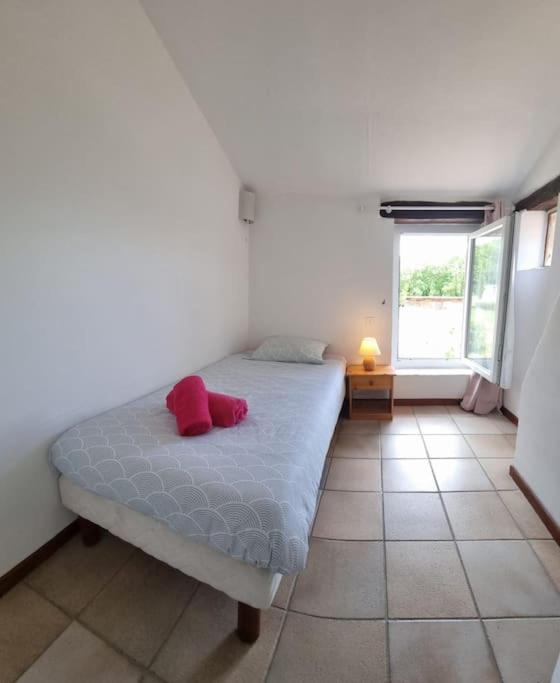 Postel nebo postele na pokoji v ubytování Maison dans un endroit paisible