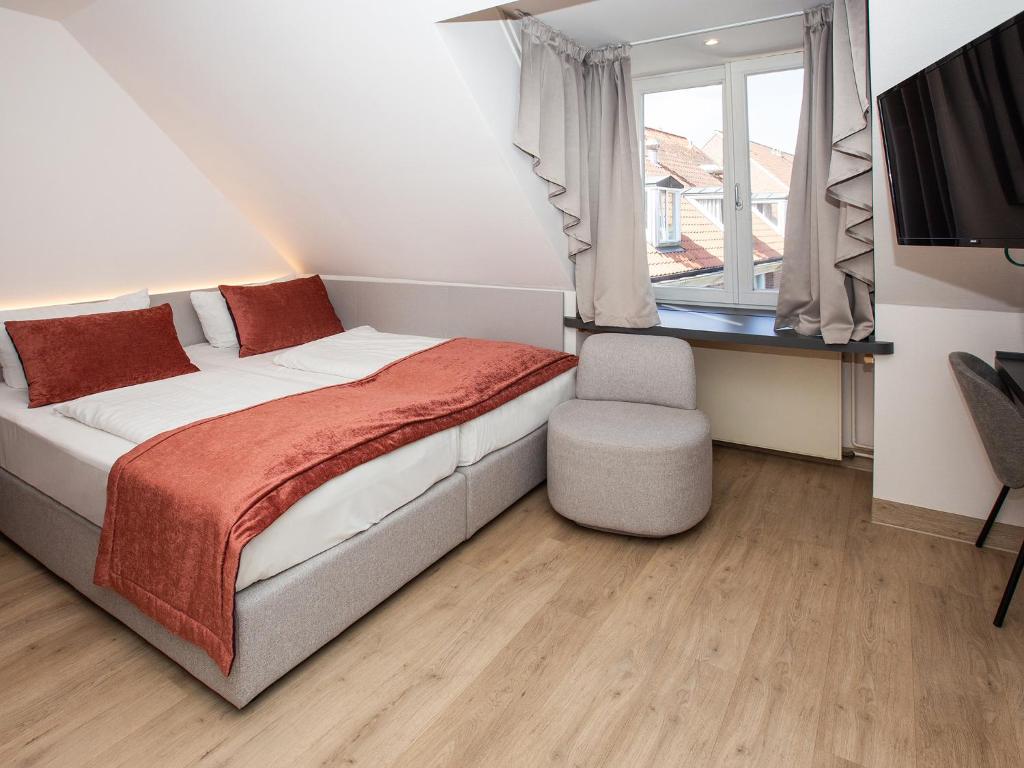 Postel nebo postele na pokoji v ubytování DORMERO Hotel Bargenturm Lüneburg