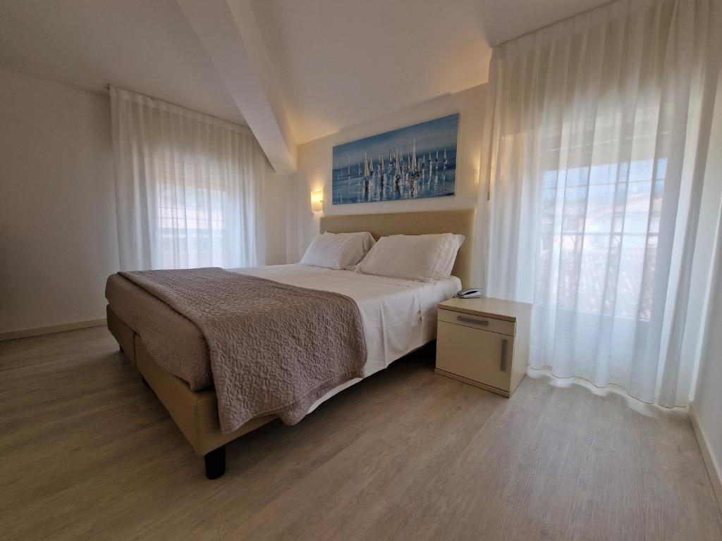 Postel nebo postele na pokoji v ubytování Hotel Villa Anthea