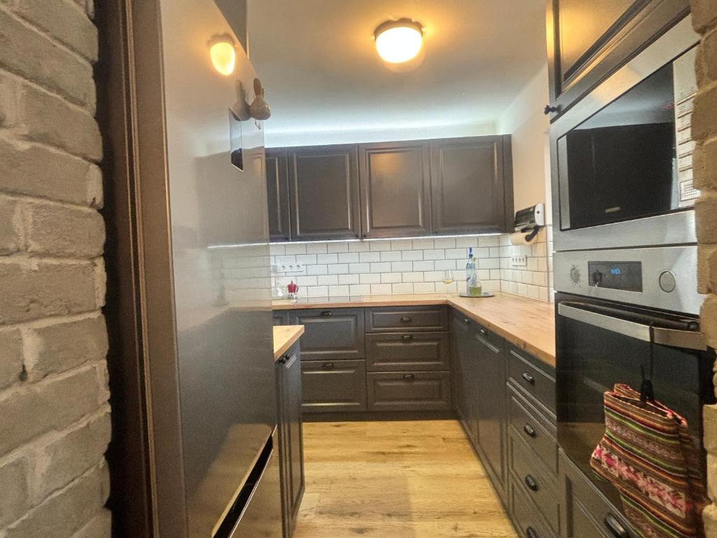 Kuchyň nebo kuchyňský kout v ubytování NEON Apartman Csopak Balaton