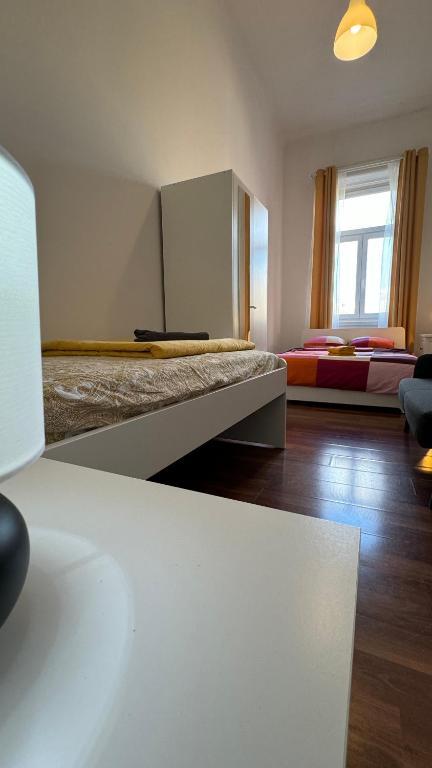 Postelja oz. postelje v sobi nastanitve Home Vibes