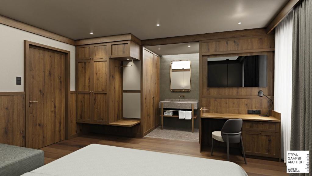 Телевизор и/или развлекательный центр в Hotel Serena Cortina