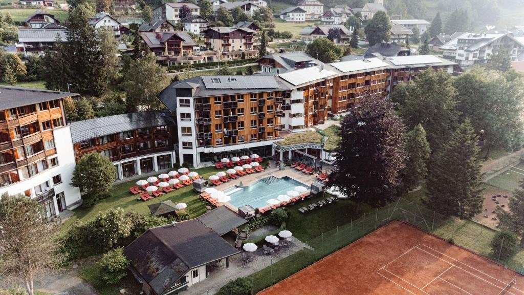 an aerial view of a hotel with a swimming pool at Hotel Die Post in Bad Kleinkirchheim