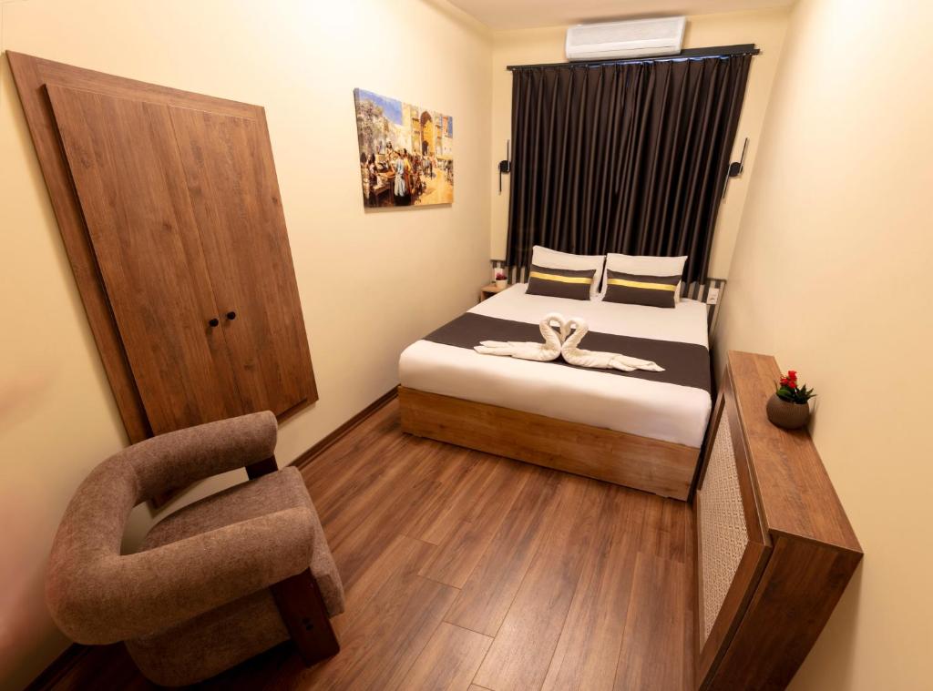 Postel nebo postele na pokoji v ubytování ROYAL TAKSIM SUITES