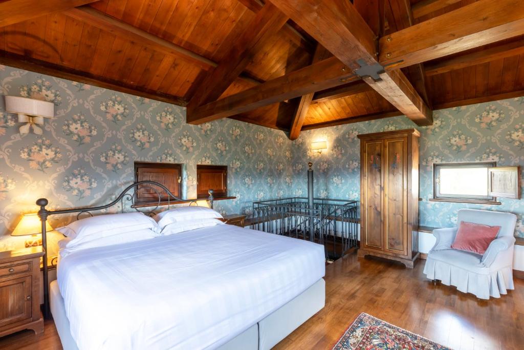 Postel nebo postele na pokoji v ubytování Relais Il Canalicchio Country Resort & SPA