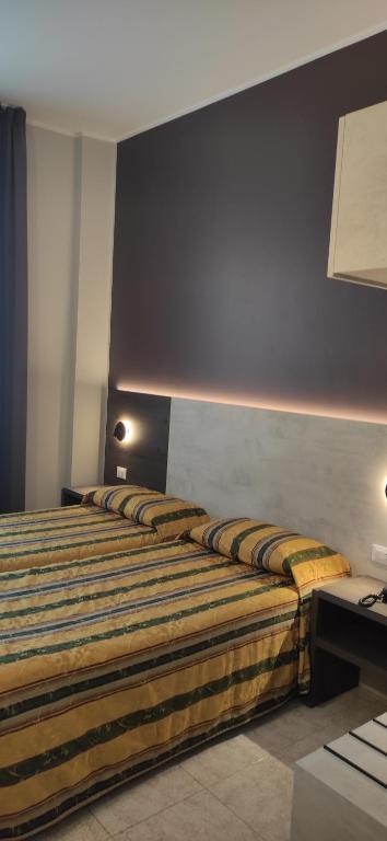 Postel nebo postele na pokoji v ubytování Hotel Mistral