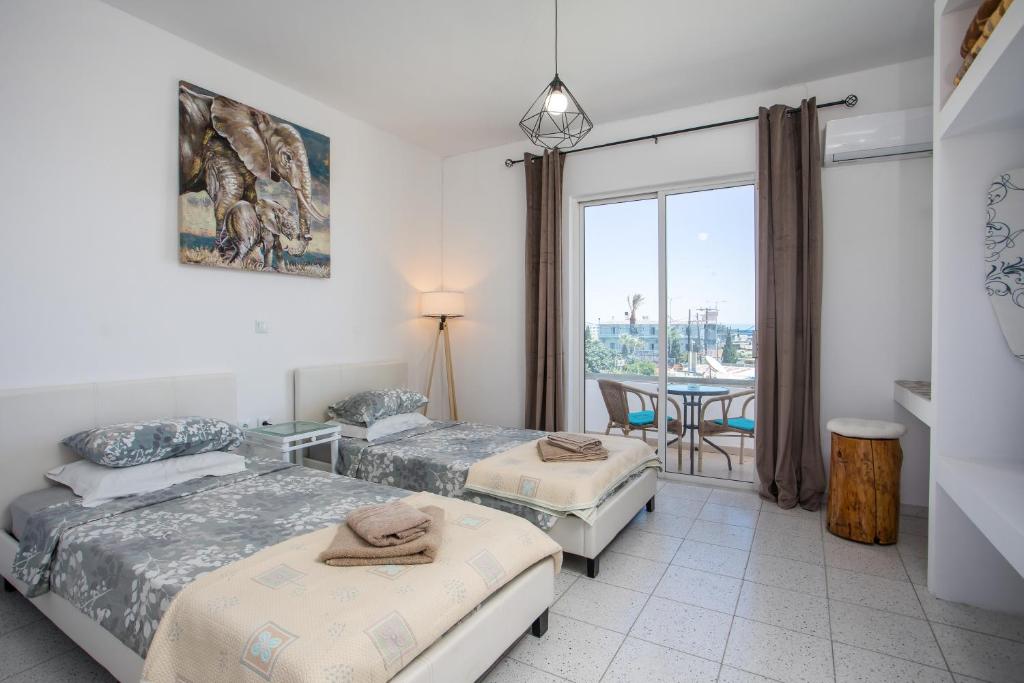 Postel nebo postele na pokoji v ubytování Lisabeth Apartments