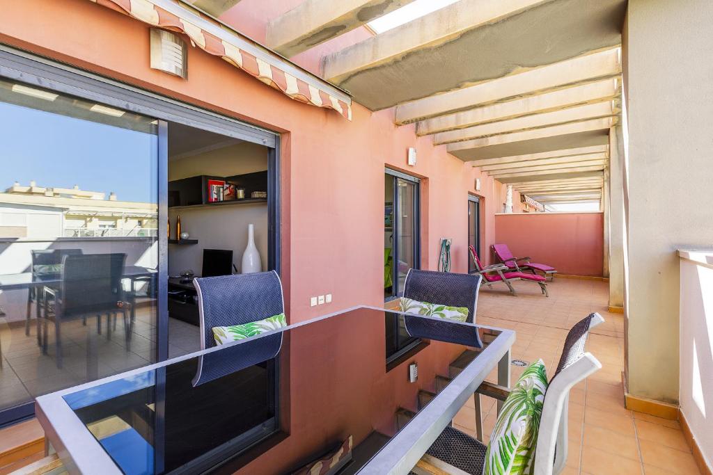 a living room with a large flat screen tv at A&N Penthouse La Vega in Caserío Almayate Bajo