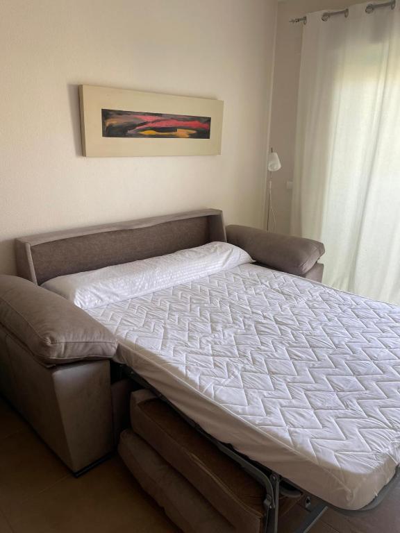 Postel nebo postele na pokoji v ubytování Estudio Daimús primera línea de playa