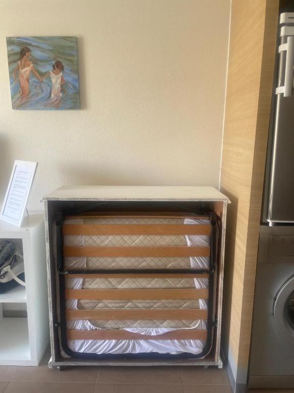 Postel nebo postele na pokoji v ubytování Estudio Daimús primera línea de playa
