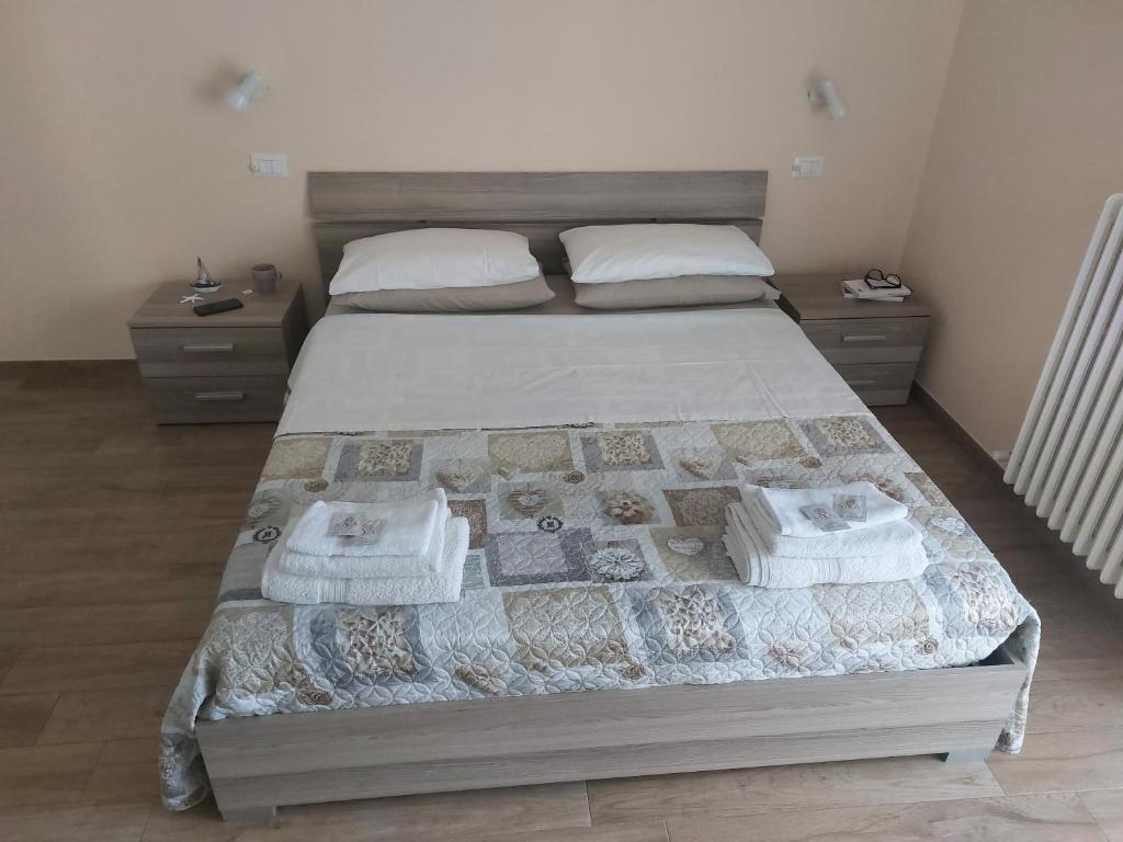 Postel nebo postele na pokoji v ubytování B&B Un posto al Sole