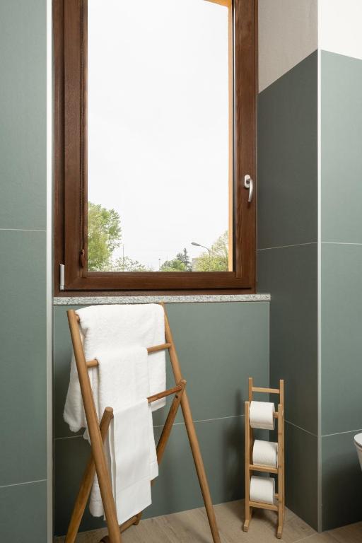 a towel rack in a bathroom with a window at Villa Il Platano in Como