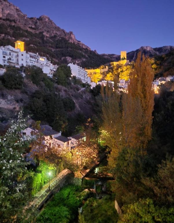 an aerial view of a city at night at Casa Rural CRISALÉN in Cazorla