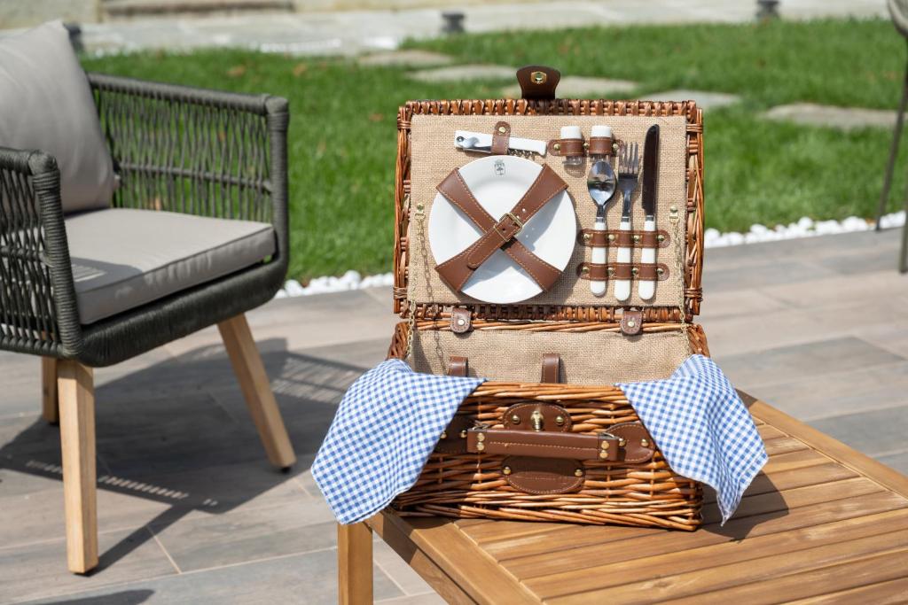 a wicker basket sitting on a table next to a chair at Villa Il Platano in Como
