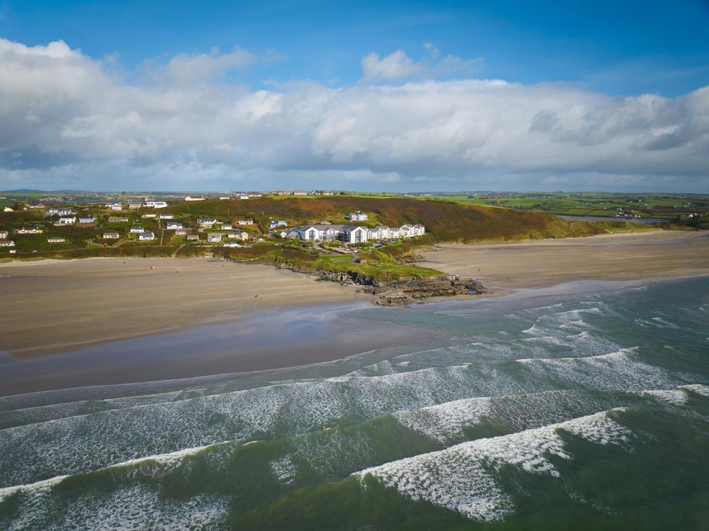 an aerial view of a beach with houses at Inchydoney Island Lodge & Spa in Clonakilty