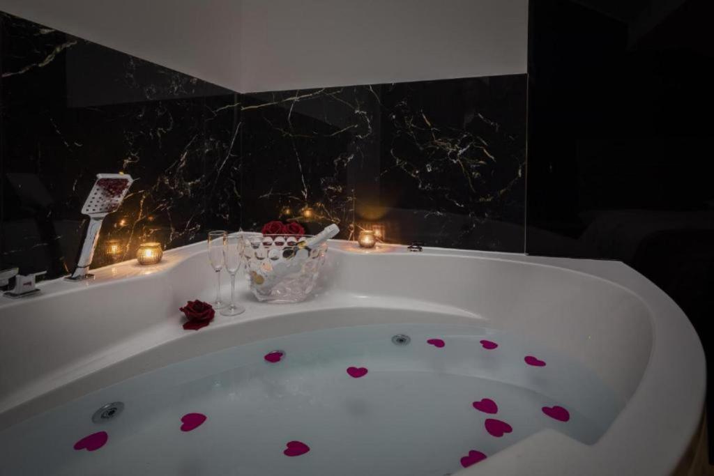 a bath tub with hearts on it with candles at Top rooms in Split
