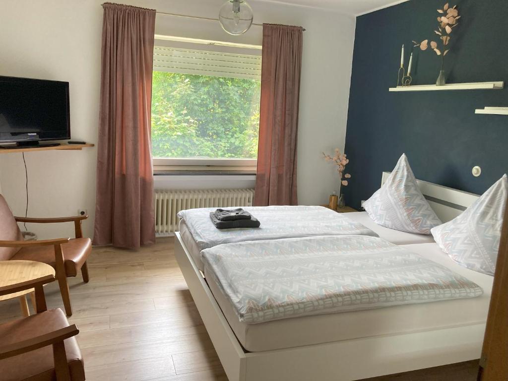 Postel nebo postele na pokoji v ubytování Bed & Breakfast Weisser Stein