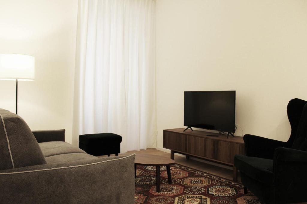 TV a/nebo společenská místnost v ubytování Testaccio's Heart