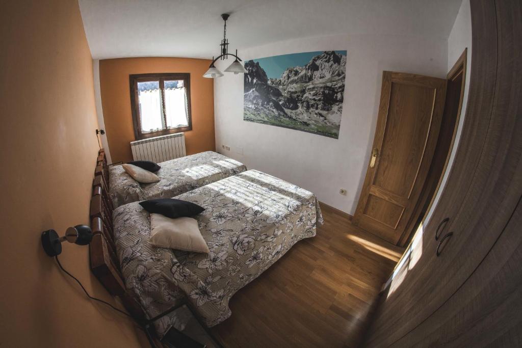 En eller flere senger på et rom på Rincón de bachatos