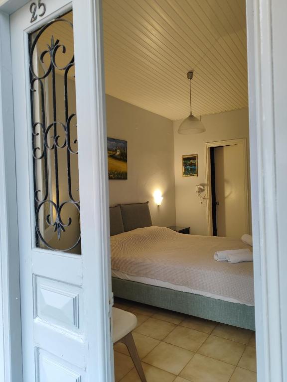 Postel nebo postele na pokoji v ubytování Sidra Hotel