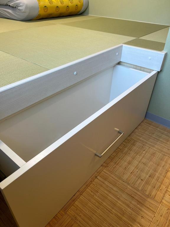 a white drawer in a room with a bed at DainHostel2 in Tokyo