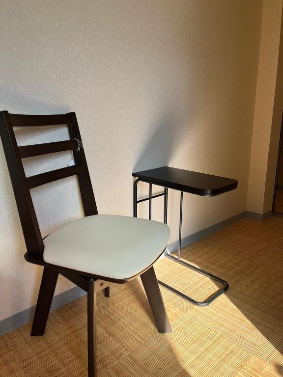 a chair and a table in a room at DainHostel2 in Tokyo
